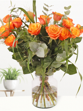 Orange rose bouquet with panicum and eucalyptus